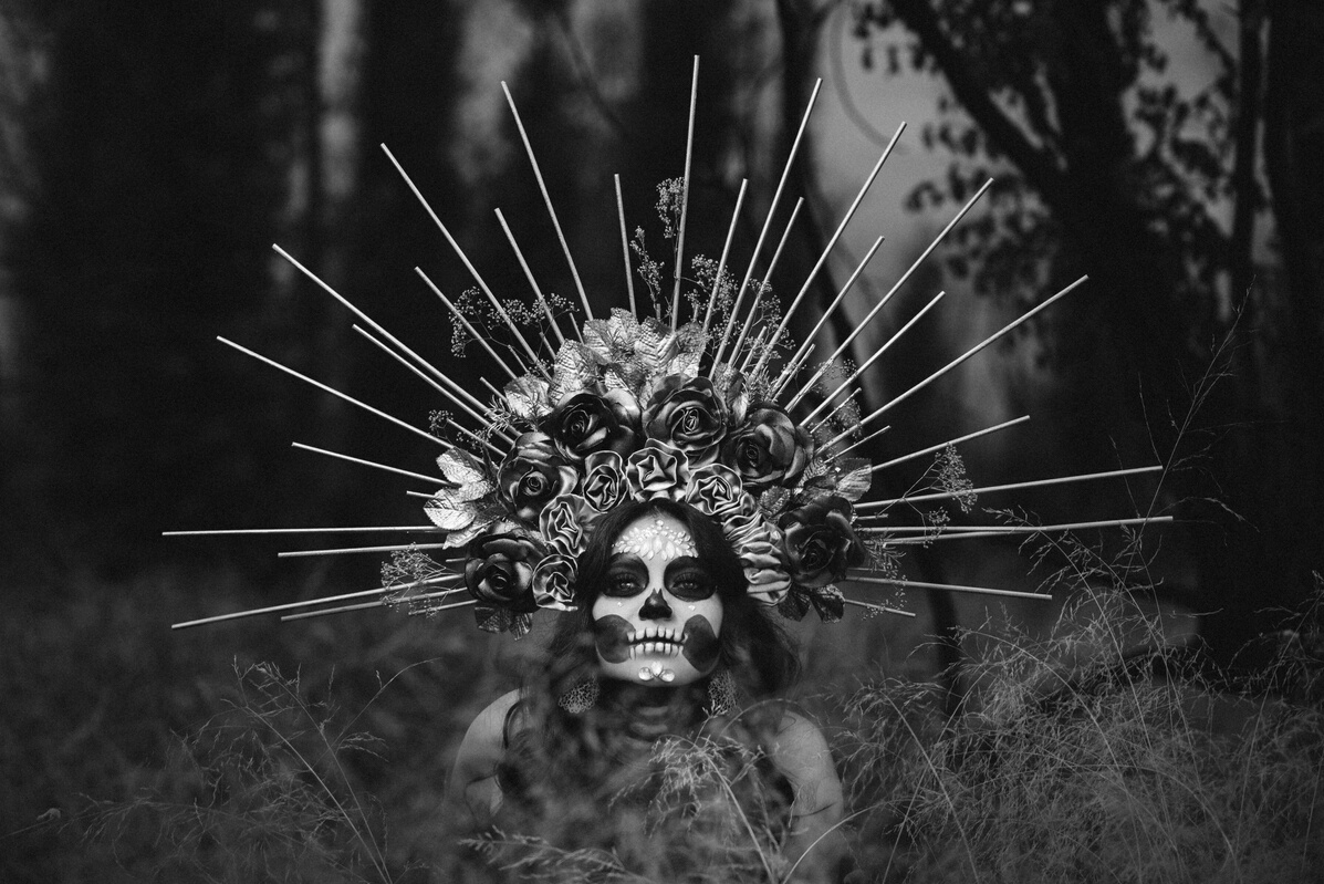 Portrait of Woman in Headdress and Face Painted for Day of the Dead